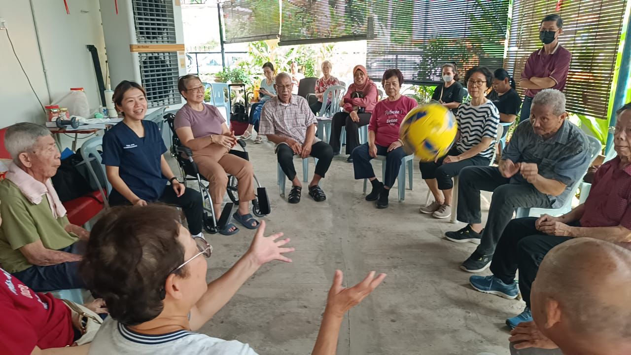 Practitioners supporting guided movement practice
